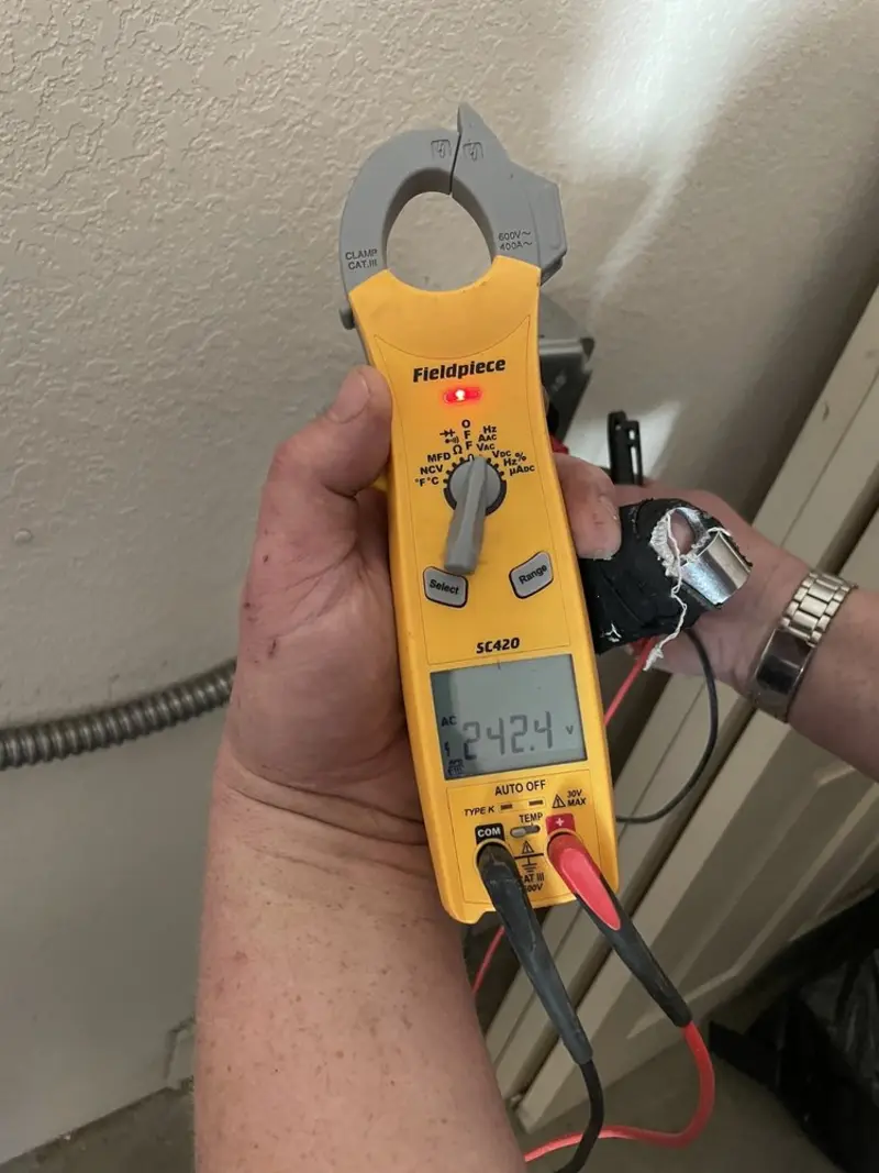 Voltage testing with clamp meter during Outlet Installation in Columbia Heights